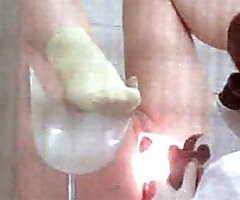 Catching a glimpse of pussy plugged with speculum