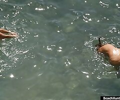 Real nude people enjoying the sea and having beach fun