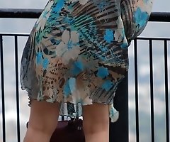 Wind upskirt - Wind lifts her dress's skirt up