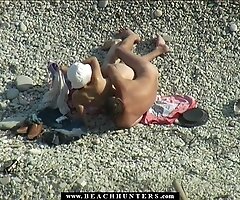 Horny guy check out the twat of his girl on a beach