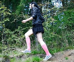 Naughty brunette tart takes a leak in the woods